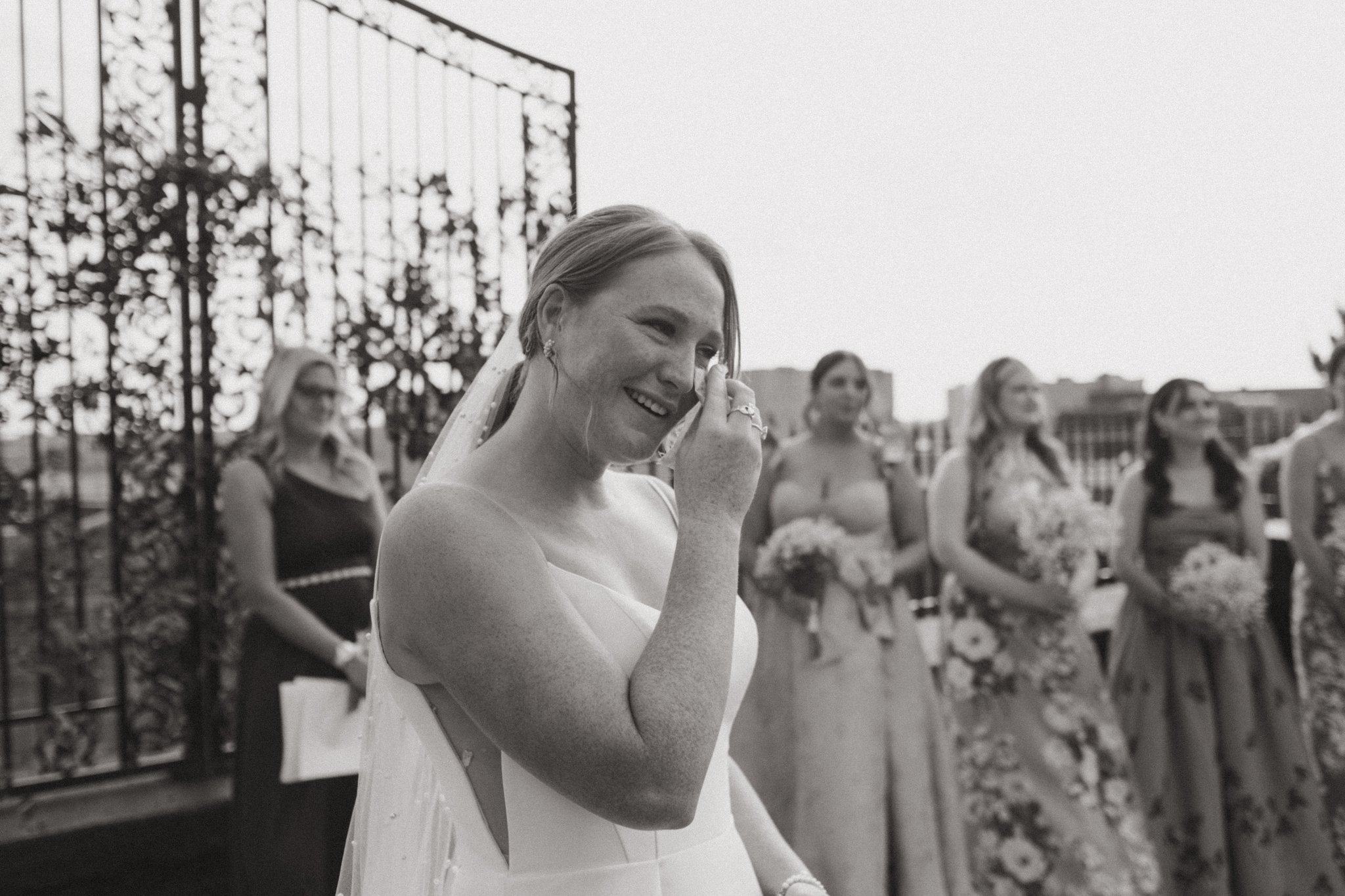 Bride sheading a tear as she watches her bride walk down the aisle.