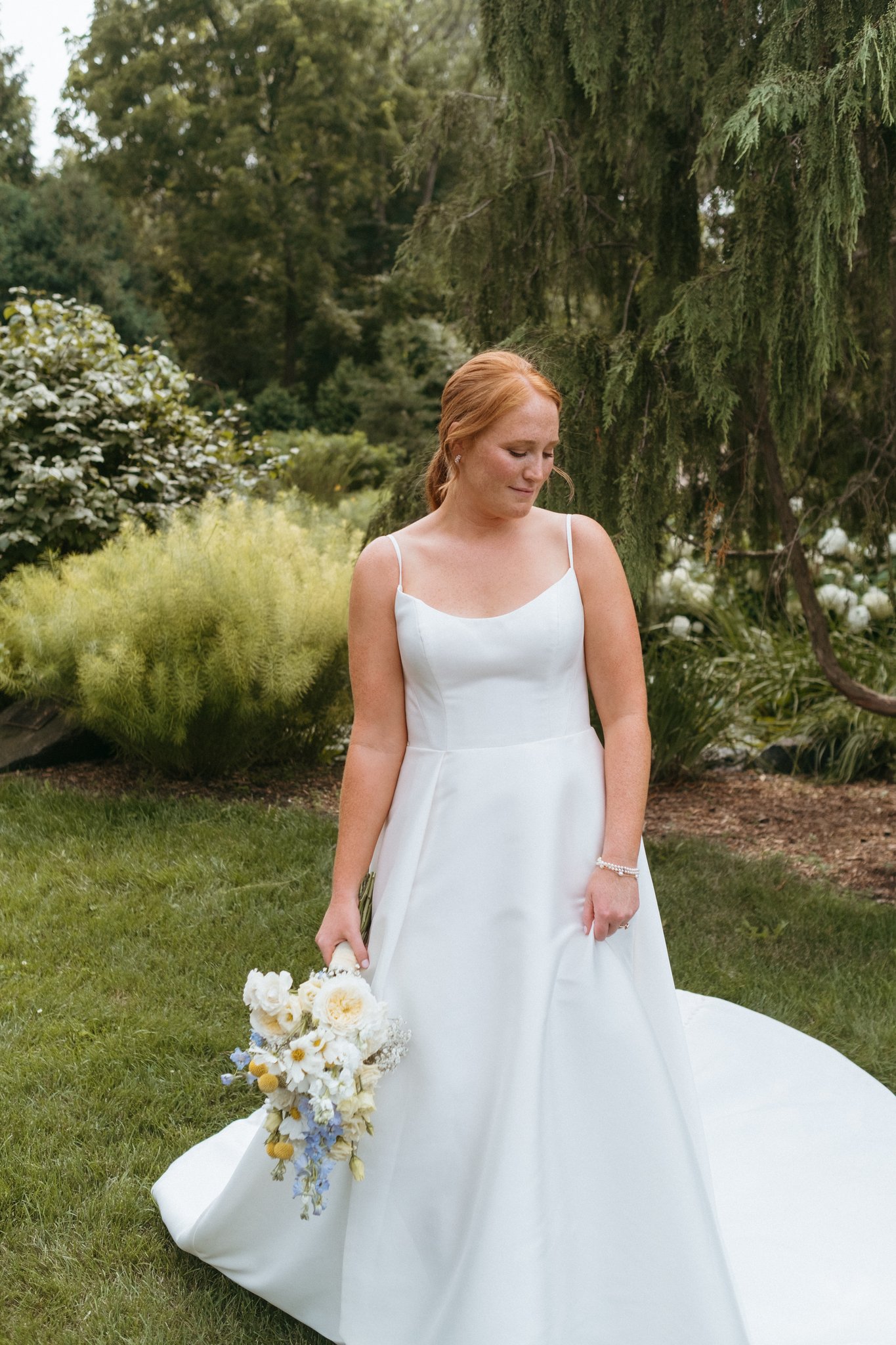 Bride in an A-line wedding dress at Klem Arboretum 