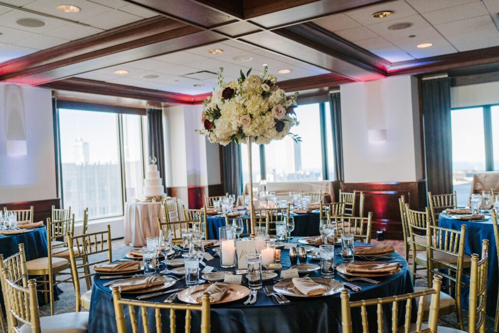 A beautiful shot of the Oak Room at The Metropolitan for a spring wedding with colors of burgundy, navy, white, champagne and blush.  